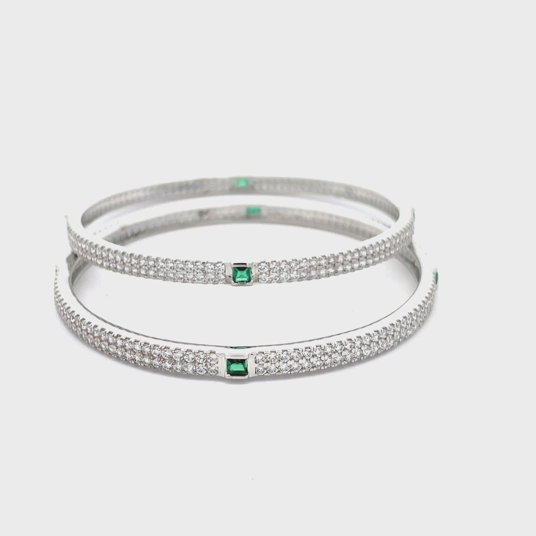 Elegant Silver Bangles with Emerald Accents